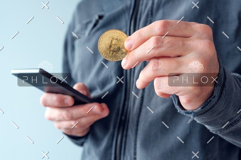 demo-attachment-11-man-with-bitcoin-and-mobile-phone-P8NS7Y4